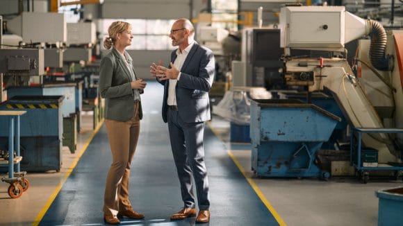 Two people discussing business
