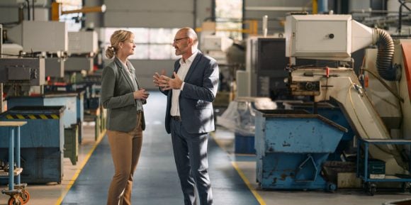 Two people discussing business