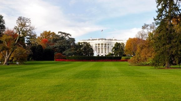 View of the White House lawn with trees in fall colors