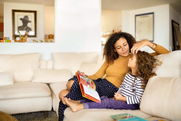 Mother and daughter reading book