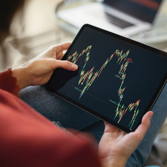 Close up of tablet with investing chart