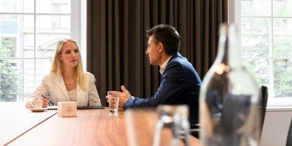 business woman speaking with client