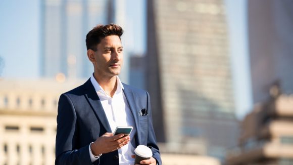 business man holding phone