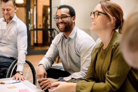 Co-workers having a conversation