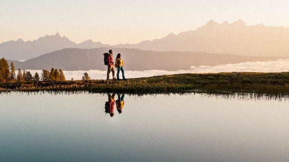 Man and woman at mountain lake