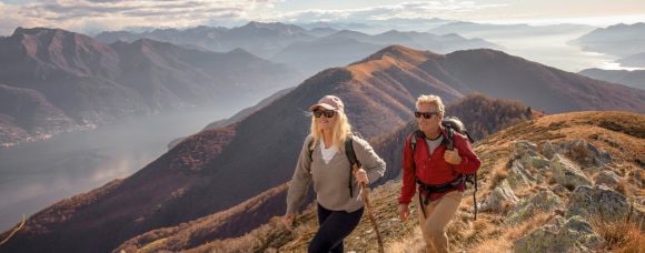 Older man and woman hiking mountain range