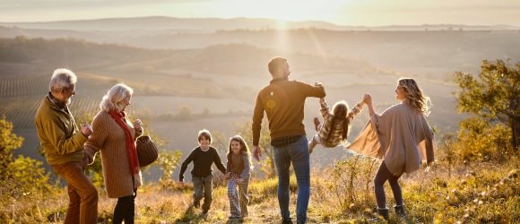 Multi-generation family having walk on their mountainside estate.