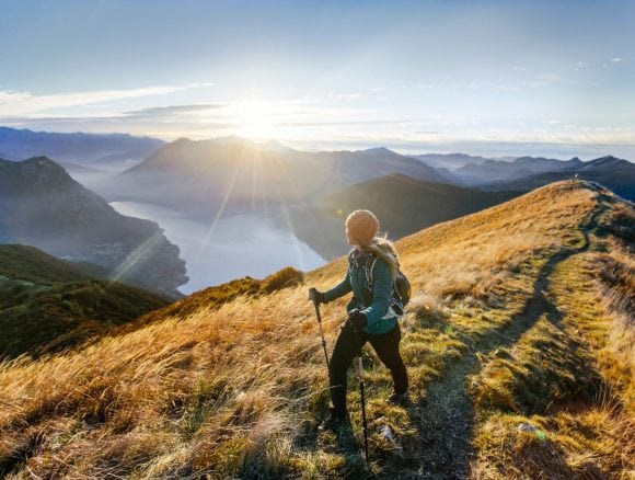 Woman hiking along mountain ridge