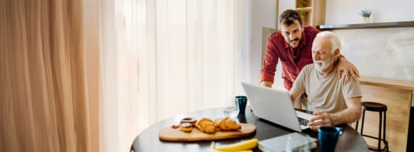 Young man helping senior