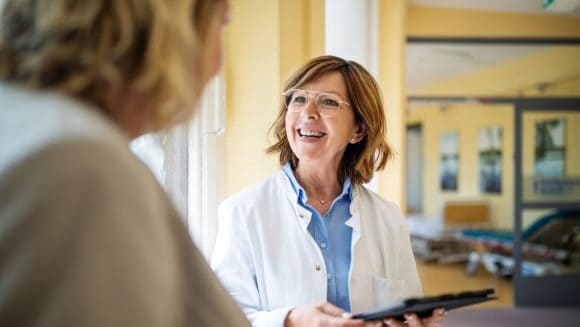 Doctor discussing with woman