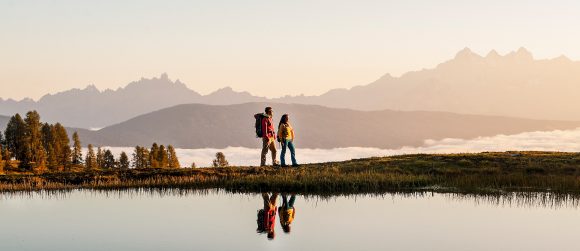 Man and woman at mountain lake