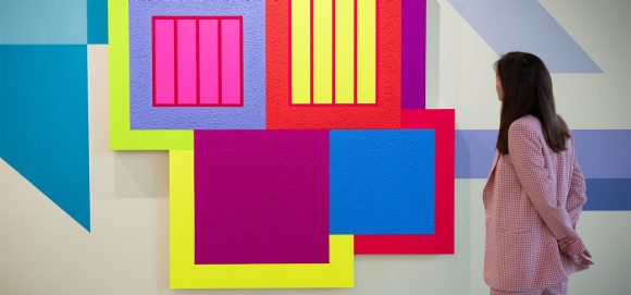 women looking at wall art