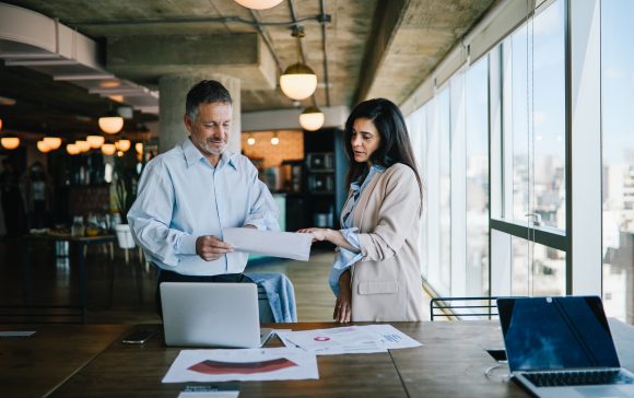 Colleagues working together in office