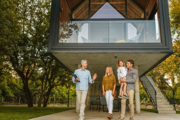 Real estate agent talking to family