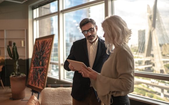 Business partners using digital tablet