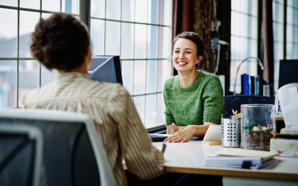 Women meeting at a desk