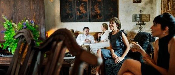 People in living room together before dinner party