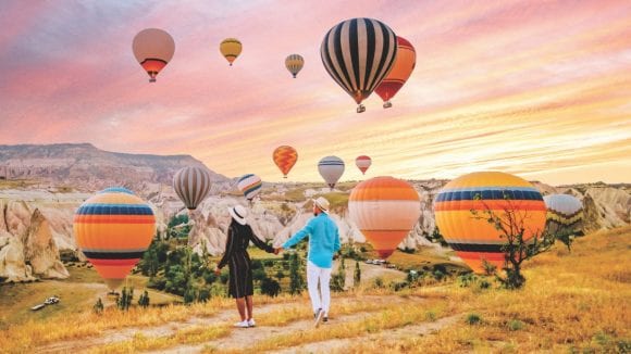 Couple watching hot air balloon