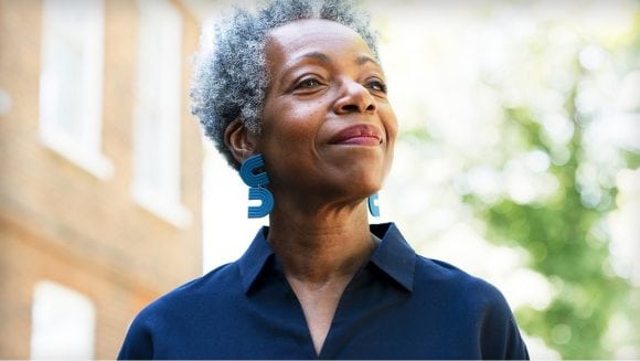 Confident woman outside in neighborhood