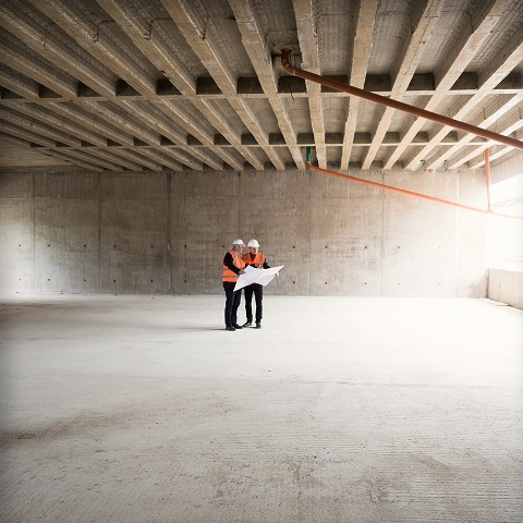 Two engineers looking at plans