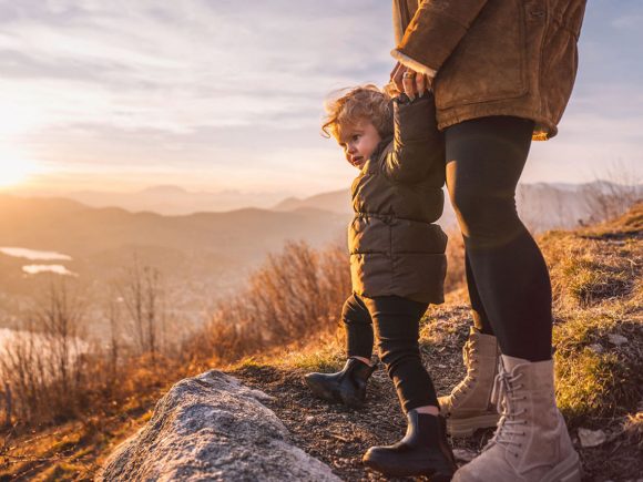 Mother and child atop mountain