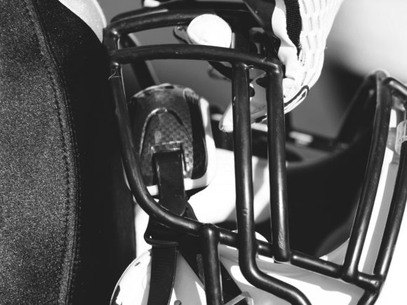 rugby player holding helmet