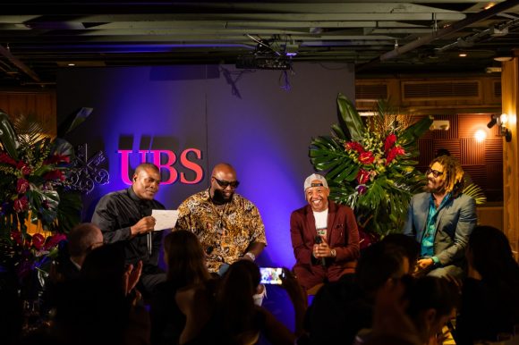 Panelists on stage in mid conversation