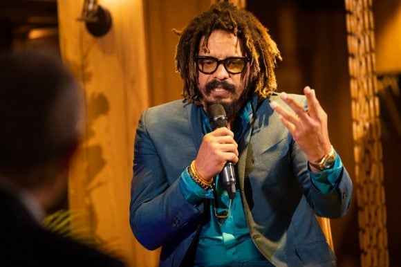Rohan Marley speaking into microphone