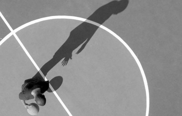 Basket ball is hanging in basket ball basket