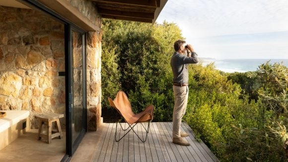 Man looking through binoculars