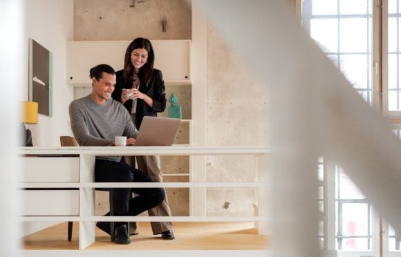 couple at desk in loft